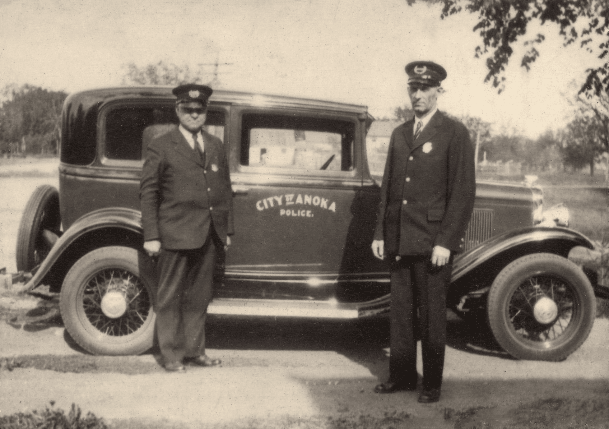 Chief John Melberg and Patrolman Jack Larson with 1930 Pontiac Squad Car